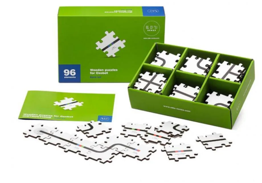 Krabice s 96 dílky sady Ozobot Puzzle a sestavenými drahami
