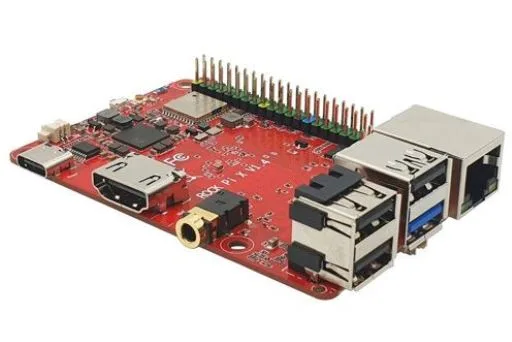 Červená jednodesková počítačová deska s GPIO lištou a několika konektory