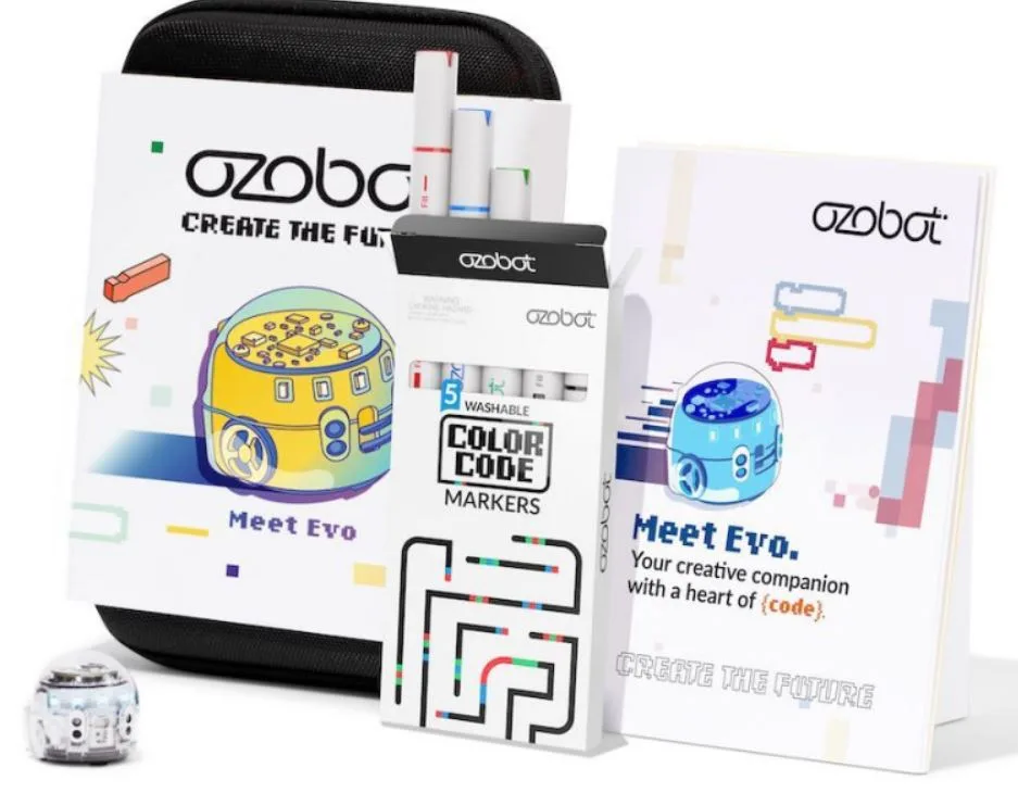 Krabice Ozobot Evo a ukázka robota s barevnými programovacími fixy