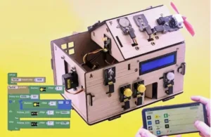 Ilustrace elektronického zařízení s ovládacím panelem, programovacími bloky a tabletem